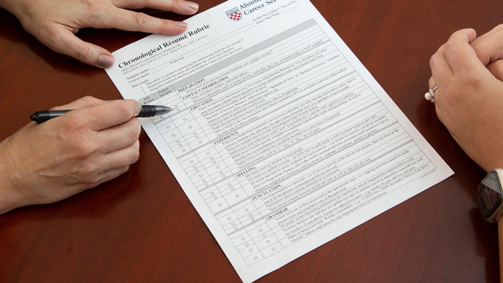 a hand showing the resume rubric