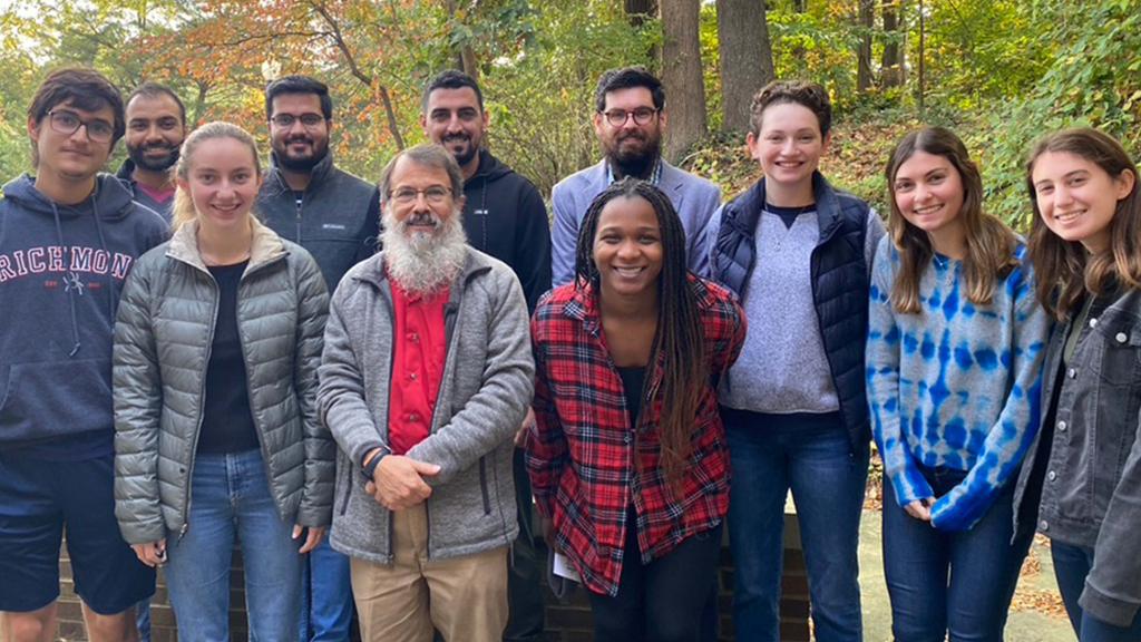 Student leaders from the Office of the Chaplaincy posing for a photo with Rav Schlesinger and Abu Awwad.
