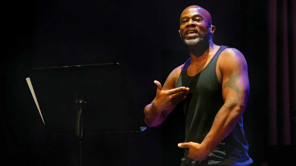 A photo of Mark Bamuthi Joseph performing on the University of Richmond campus