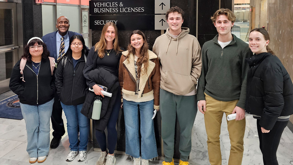 A photo of education professor Wendell Roberts and students at Richmond City Hall.