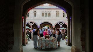 People attending an event in the courtyard of the International Center.