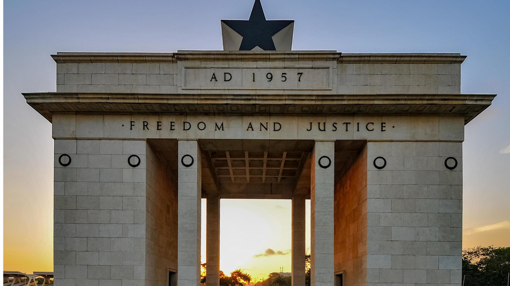 A large stone building with the words freedom and justice on the front
