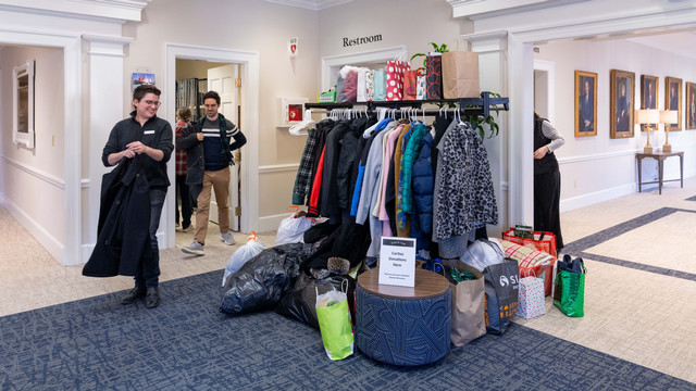 Donated coats and other winter weather accessories in the lobby of Jepson Alumni Center.