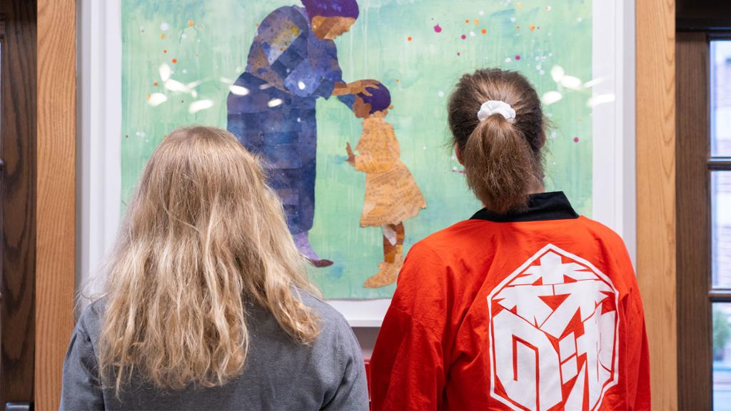 Students looking at artwork