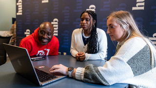 Three students in the spider hub