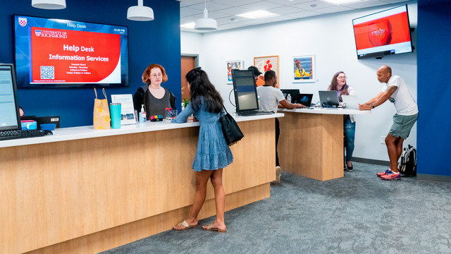 People getting support at the Help Desk