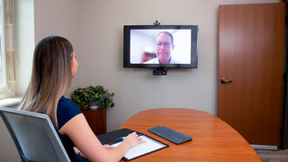 A woman in an online meeting