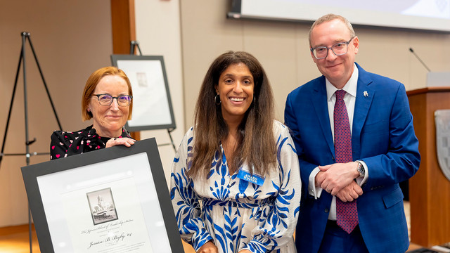 Dean Sandra Peart and President Kevin Hallock present Jessica Bigby, '04, with the Jepson School Alumni Award.