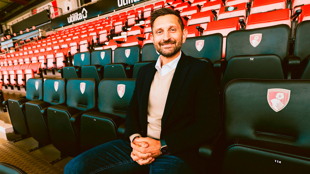Tim Bezbatchenko sitting in an empty soccer arena