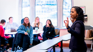 A photo of professor Lauren henley teaching a class