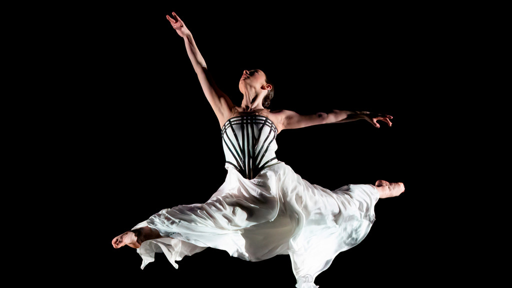 a young dancer soars through the air