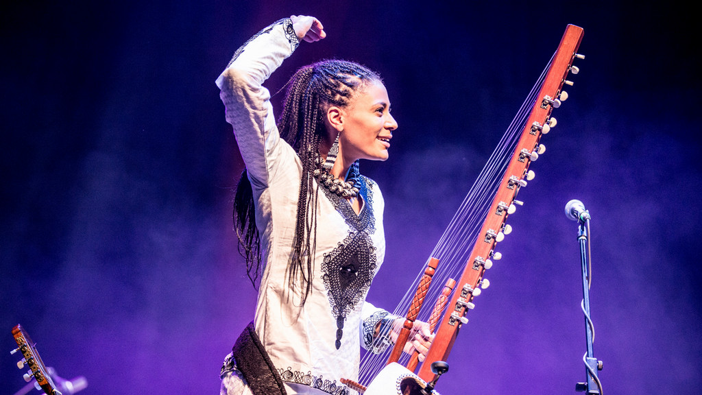 Sona Jobareth holding the kora following a live performance