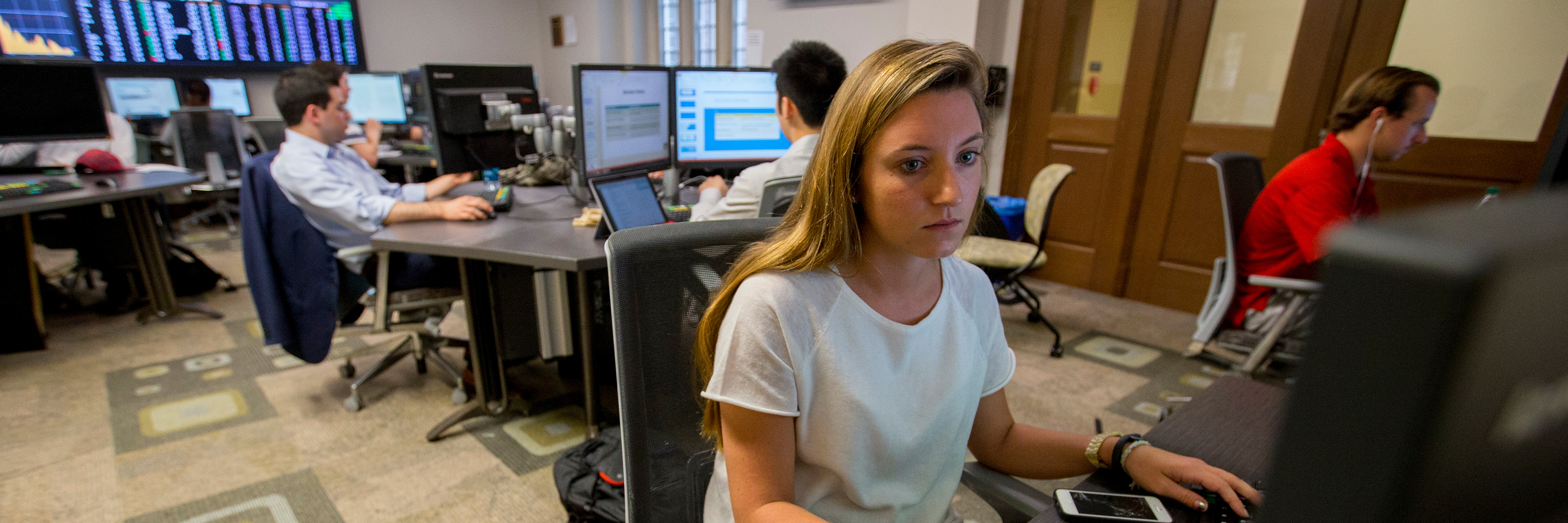 Students working in a business school computer lab