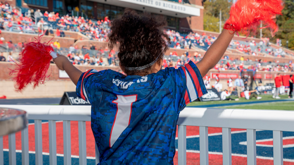 Young person cheering in the Red Zone at Robins Stadium