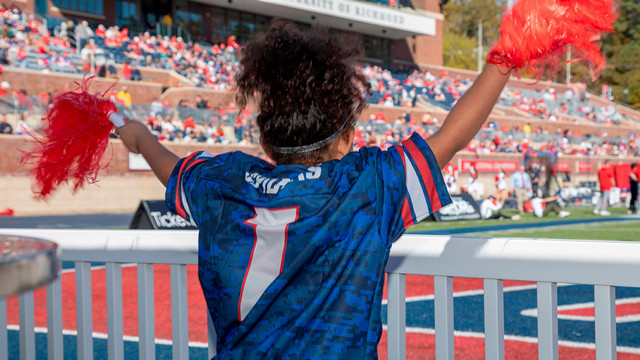 Young person cheering in the Red Zone at Robins Stadium