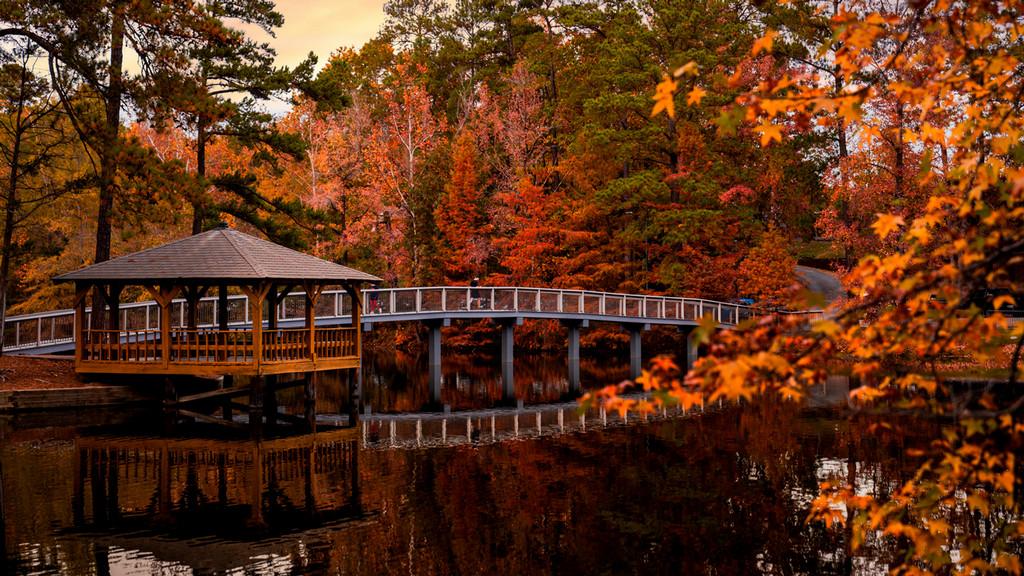 Gazebo on a lake island surrounded by fall foliage