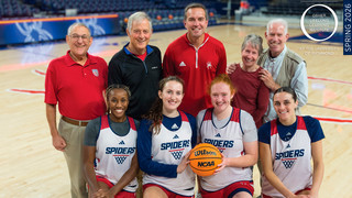 Women's basketball team players and coach with Osher members on center court
