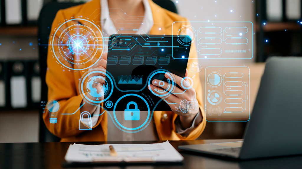 Computing circuitry and security icons overlaid on a person holding a tablet