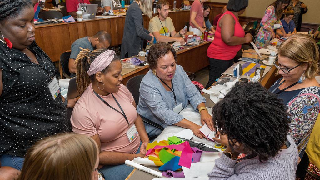 Educators at a table working together during a hands-on workshop