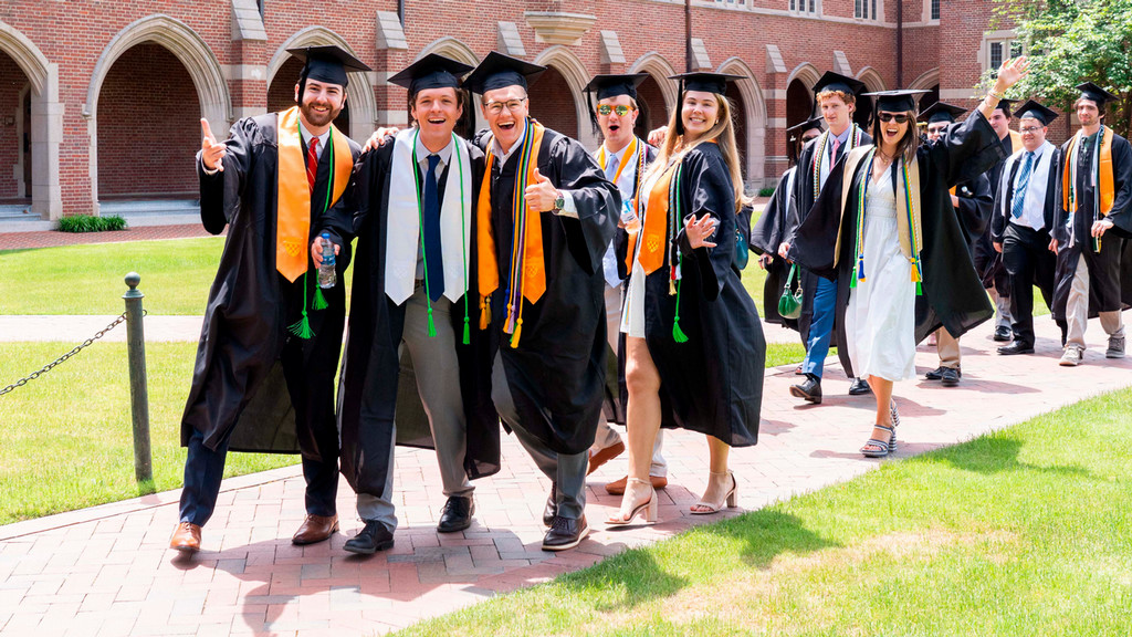 Students in regalia walking to graduation ceremony