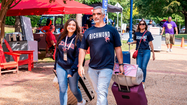 Student and father carrying bags