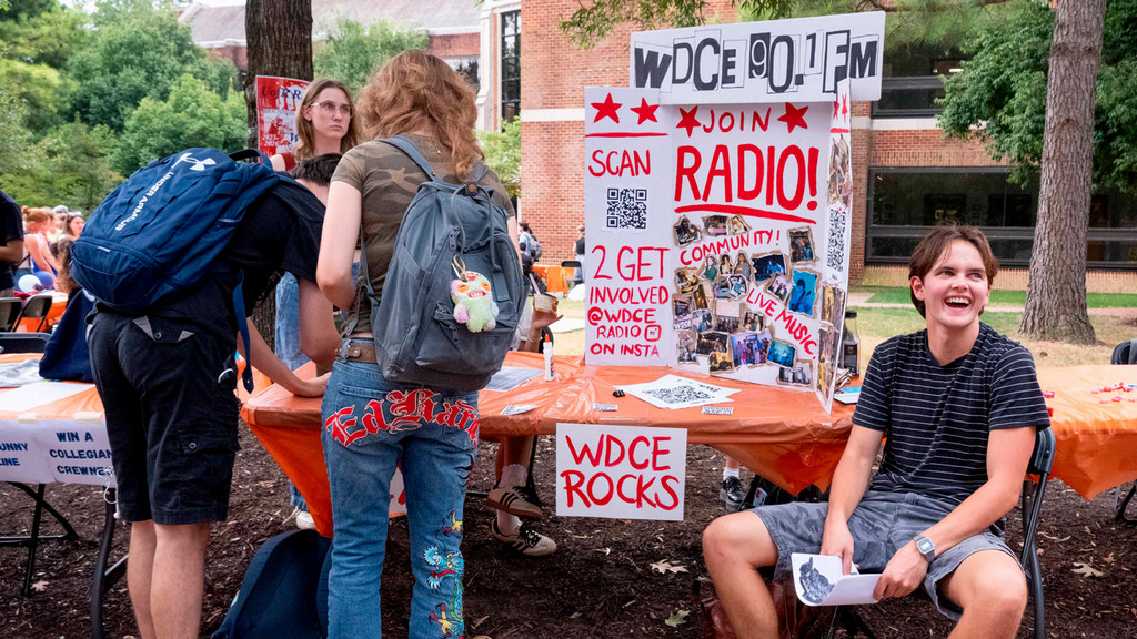 Students in front of radio station table