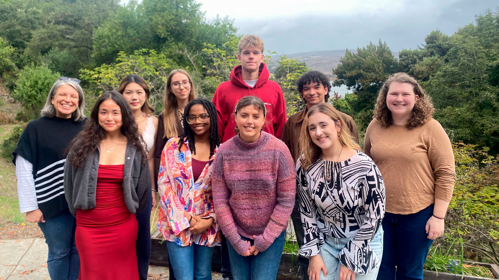 Students posing for photo outside on a pilgrimage