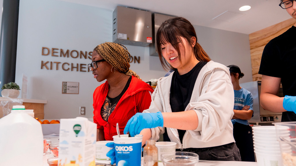 Students preparing food in the Demo Kitchen
