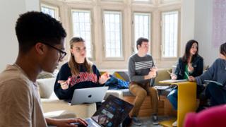 Students work collaboratively in a study space.