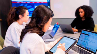Student using tablet in meeting