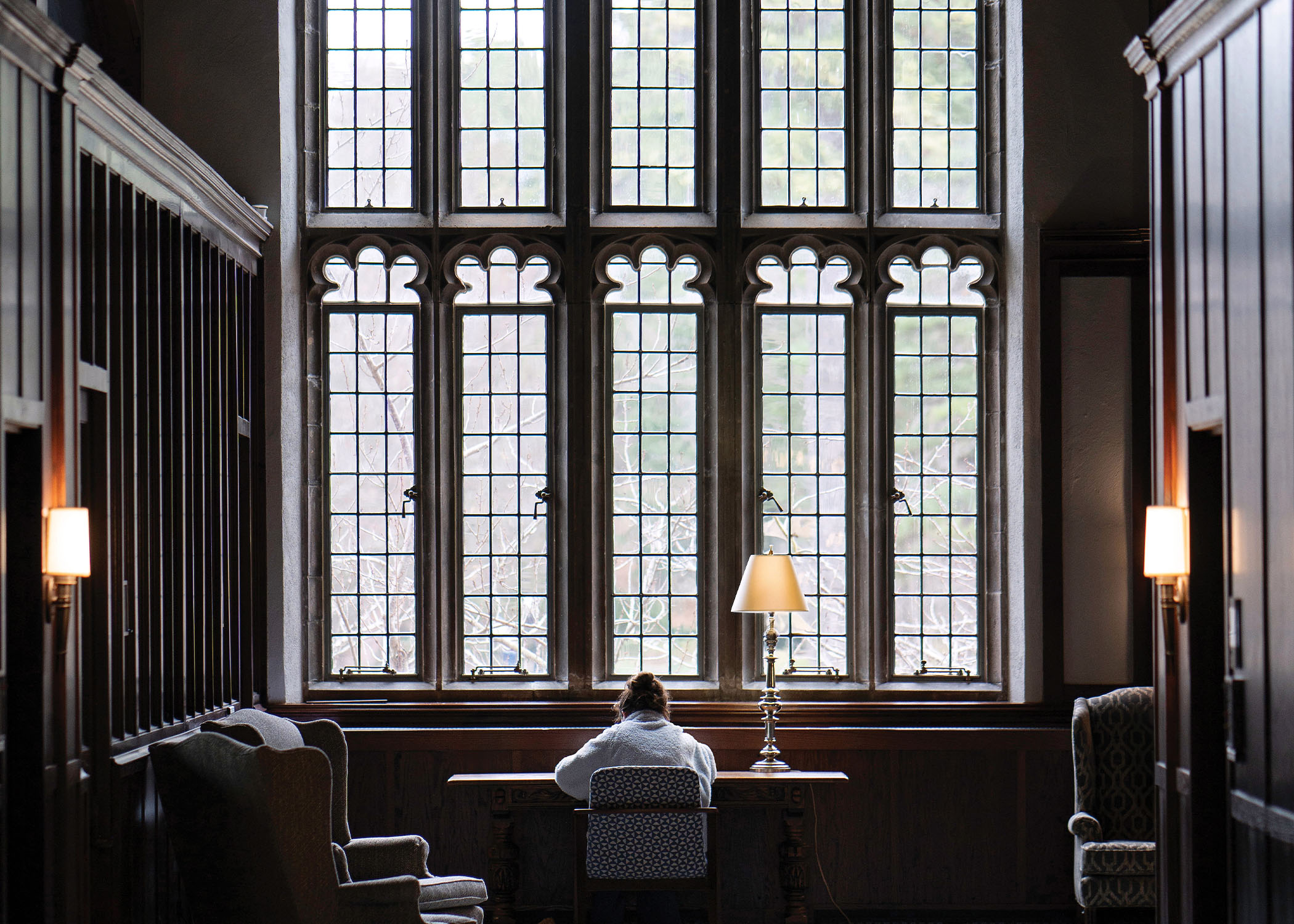 University of Richmond student studying at a desk in the Great Hall