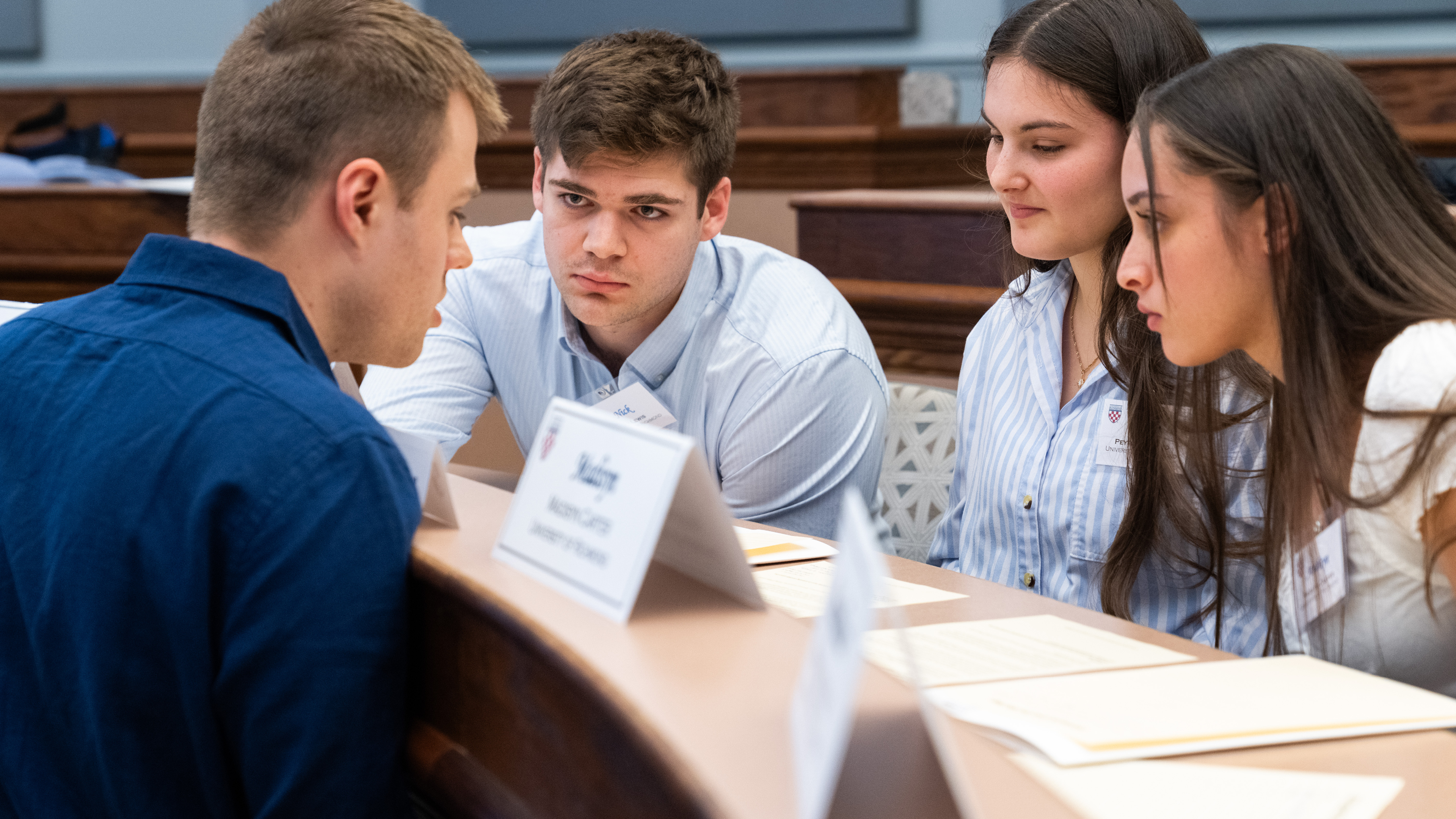 From left, seniors Maximilian Weiss and Nick Lewis and sophomores Peyton Noland and Madisyn Carter discuss a case at the Applied Ethics Bowl.