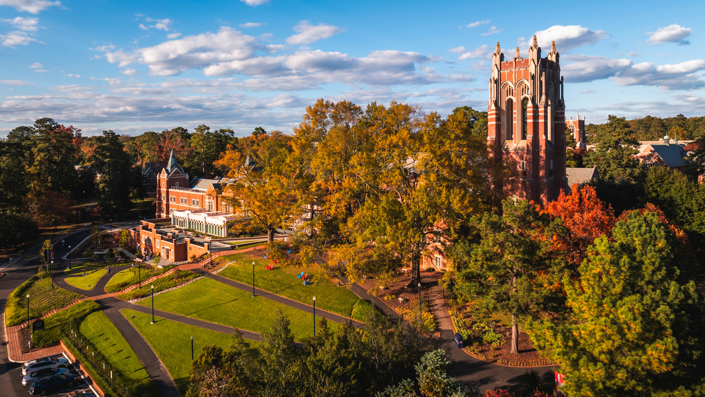 An aerial photo of the University of Richmond campus in the fall, featuring boatwright tower and the newly renovated library.