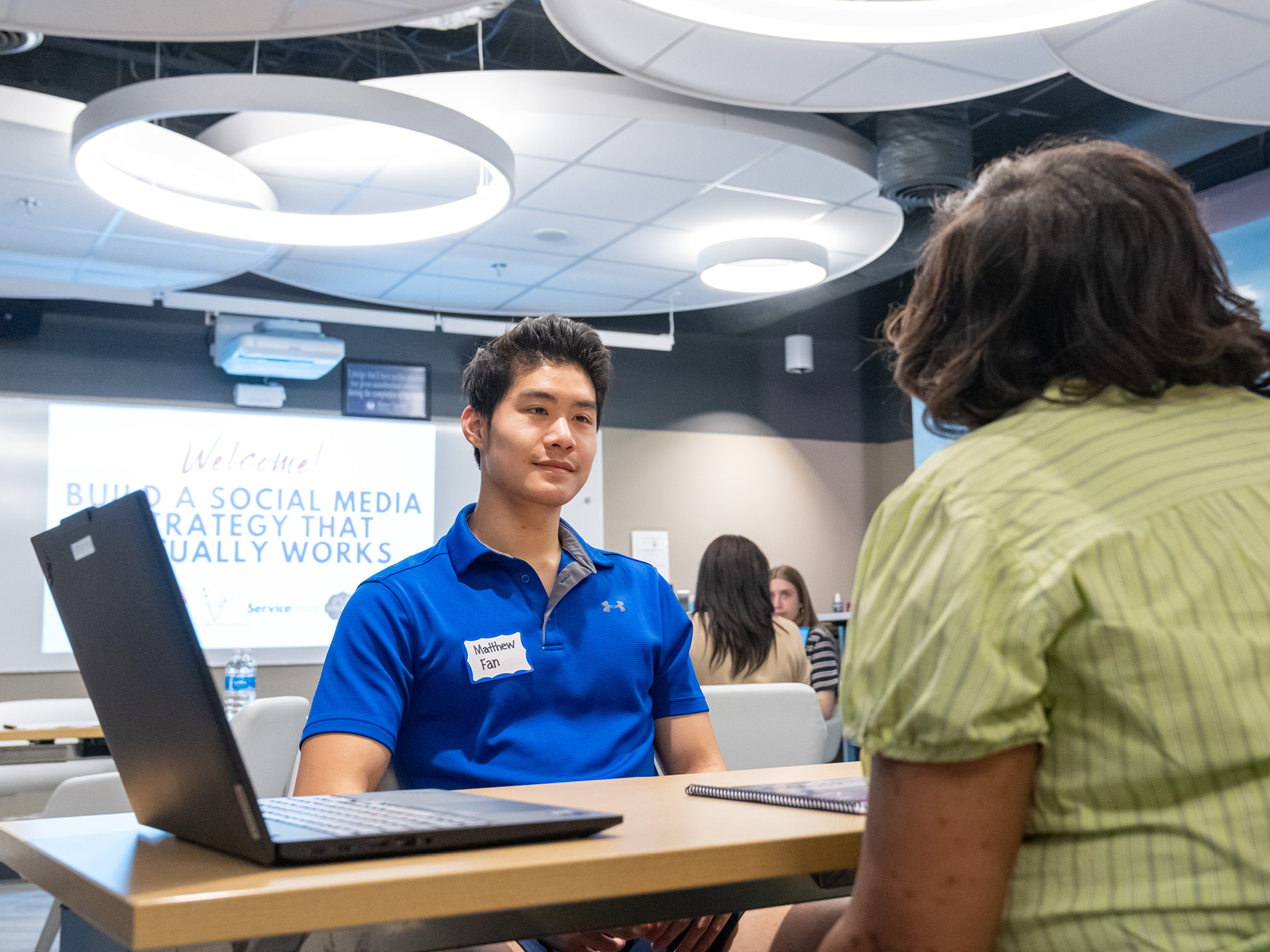UR Student Matthew Fan meets with a potential client as part of the Spider Business Hub.
