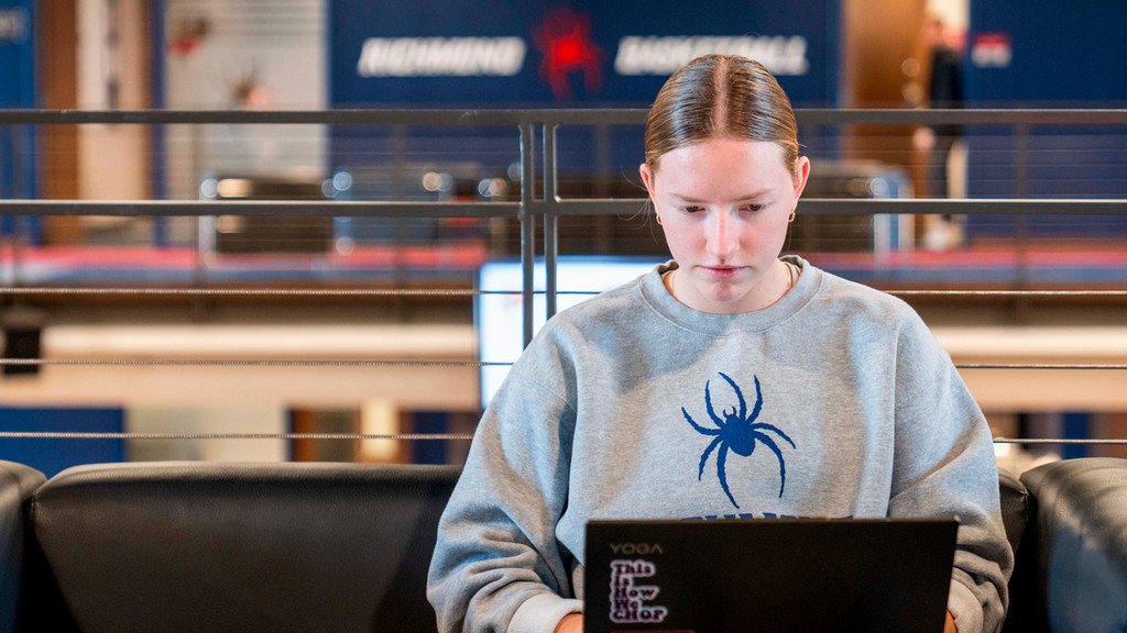 University of Richmond student-athlete working on laptop